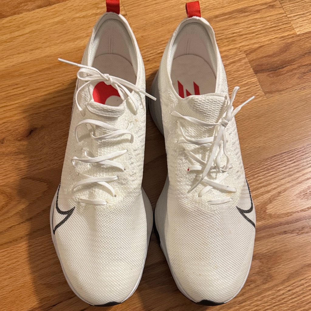 White Nike Zoom Athletic Sneakers With Red Accents